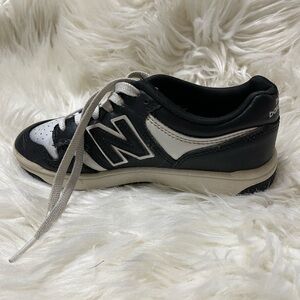 New Balance Kids Black and White Sneakers.